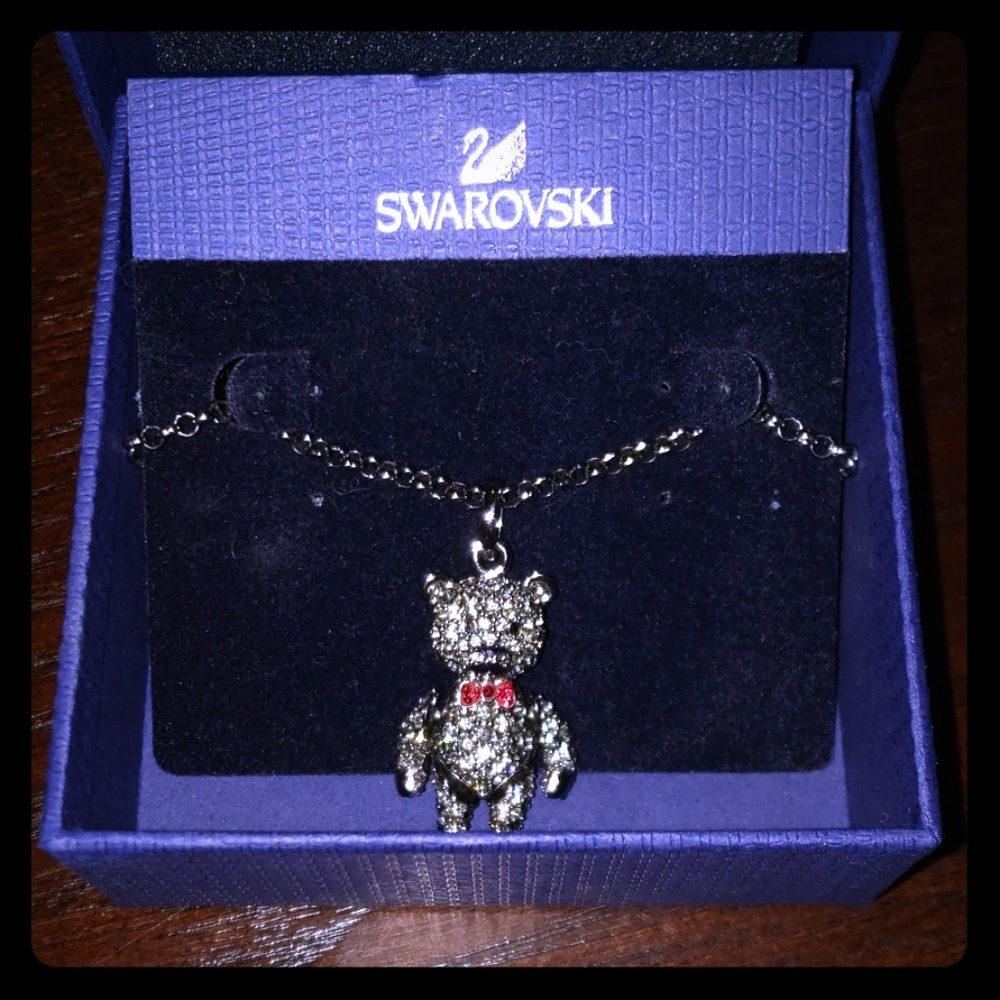 Dancing Swarovski Bear with a red bowtie